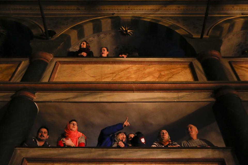 Visitors wait for a religion service at the Patriarchal Church of St. George in Istanbul, Sunday, Jan. 6, 2019. An independent Ukrainian Orthodox church has been created at a signing ceremony in Turkey, formalizing a split with the Russian church it had been tied to since 1686. (AP Photo/Lefteris Pitarakis)
