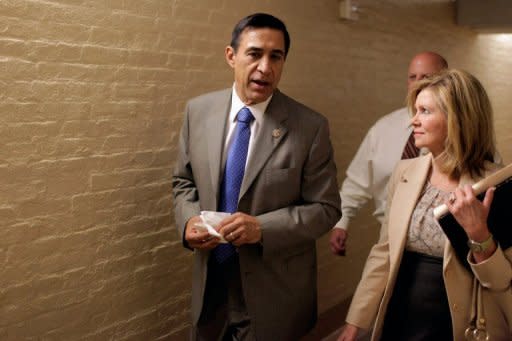 House Oversight and Government Reform Committee Chairman Darrell Issa (L) and Rep. Marsha Blackburn (R) leave the weekly House Republican conference meeting. The oversight committee voted last week to hold Attorney General Eric Holder in contempt of Congress and a vote by the full House is expected on Thursday