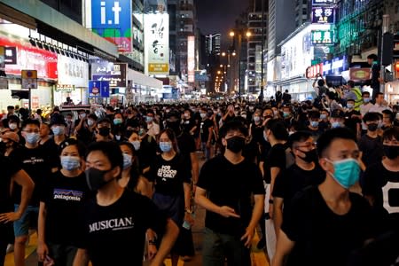 FILE PHOTO: Anti-extradition bill protesters march at Hong Kong's tourism district Nathan Road near Mongkok