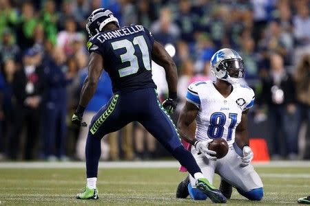 Oct 5, 2015; Seattle, WA, USA; Seattle Seahawks strong safety Kam Chancellor (31) reacts after his tackle against Detroit Lions wide receiver Calvin Johnson (81) during the fourth quarter at CenturyLink Field. Mandatory Credit: Joe Nicholson-USA TODAY Sports