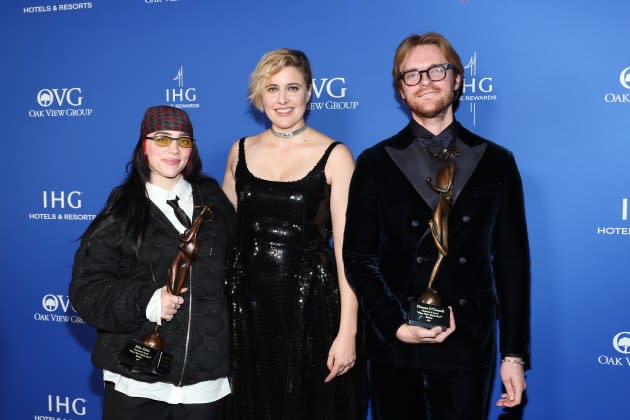 Billie Eilish and Finneas, winners of the Chairman’s Award for "Barbie," and Greta Gerwig pose backstage during the 35th Annual Palm Springs International Film Awards.  - Credit: Amy Sussman/Getty Images for IHG Hotels & Resorts
