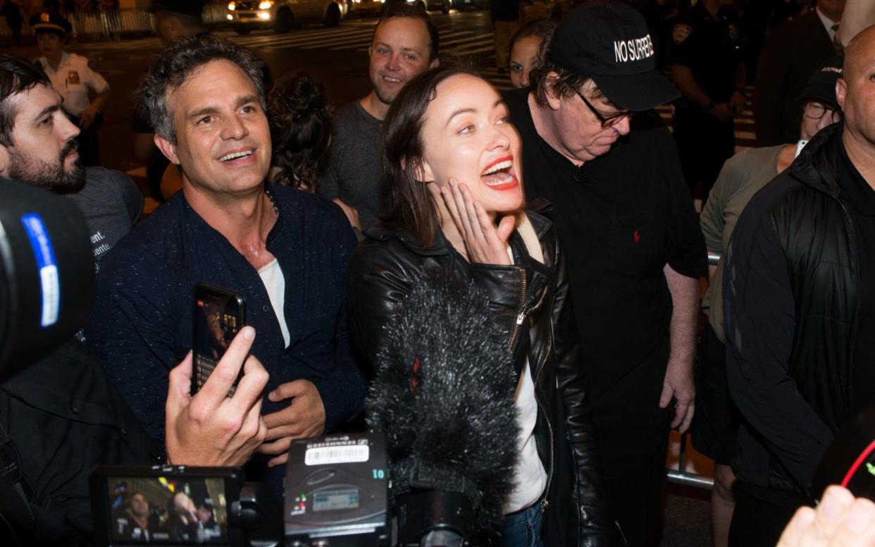 Actors Mark Ruffalo and Olivia Wilde join Michael Moore as he leads his Broadway audience to Trump Tower to protest Donald Trump on Tuesday night - Getty Images North America