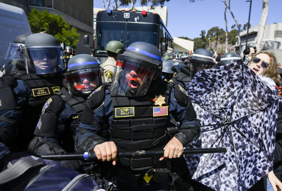 California Highway Patrol officers clash with protesters at UC San Diego Monday, May 6, 2024, in San Diego. Police cleared a campus Pro-Palestinian encampment in the early morning Monday. (AP Photo/Denis Poroy)
