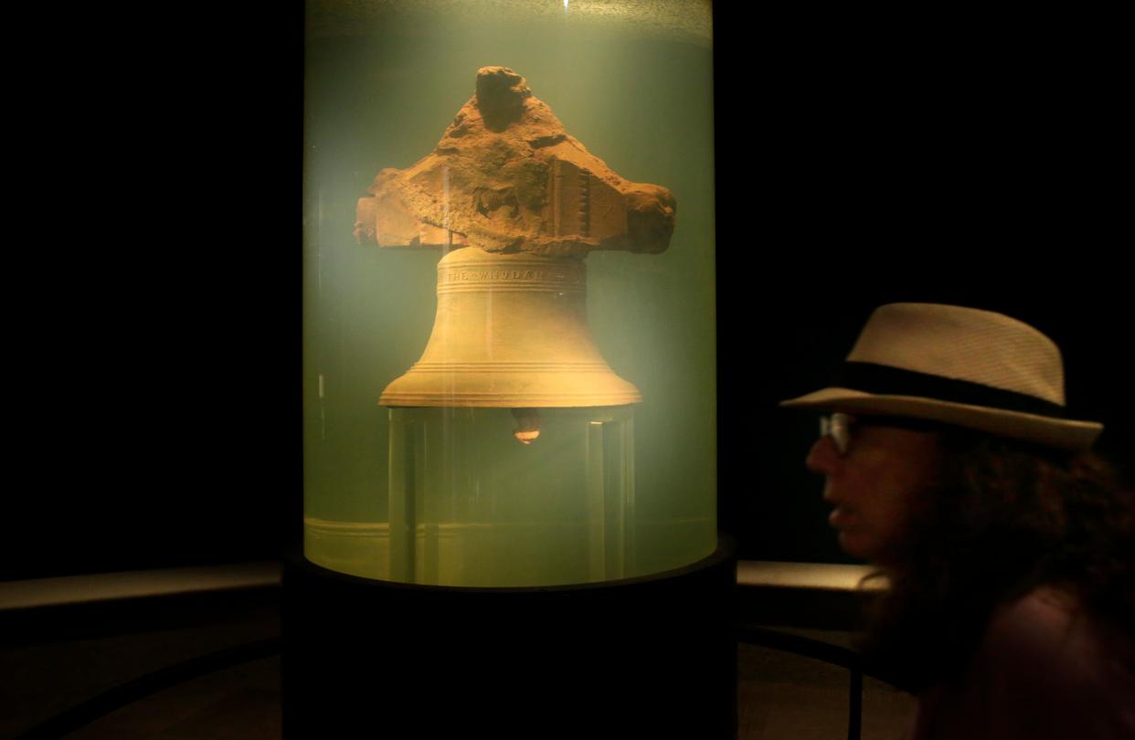 In this 2016 file photo, a museum visitor walks by a display of a bell once belonging to the pirate ship Whydah Gally at the Whydah Pirate Museum, in Yarmouth, Mass.  (Photo: ASSOCIATED PRESS)