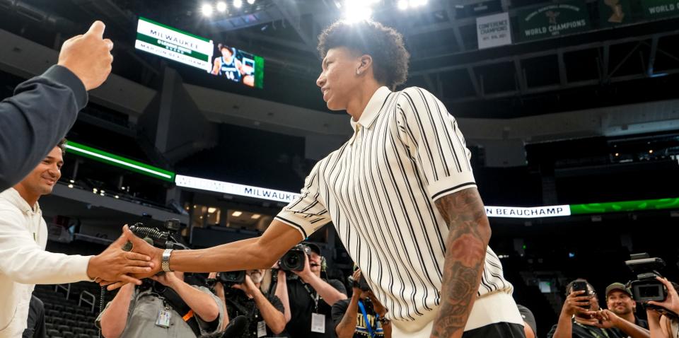 Milwaukee Bucks first-round draft pick MarJon Beauchamp is welcomed by team employees during his introductory news conference Tuesday at Fiserv Forum.