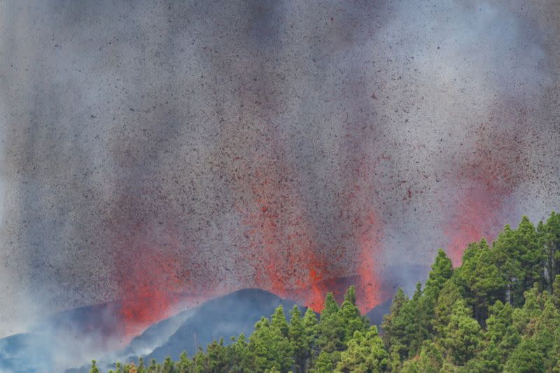 Lava and smoke rise following the eruption of a volcano in Spain