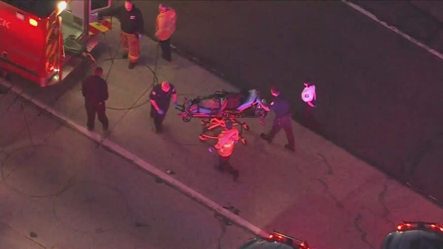 The suspect was placed onto a gurney and transported to the hospital for medical evaluation. (KTLA)