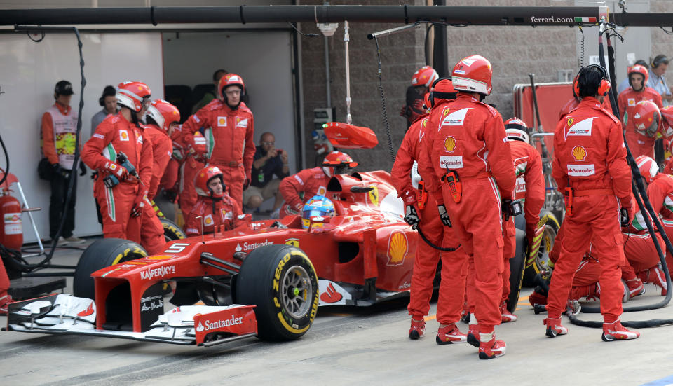 Ferrari driver Fernando Alonso of Spain steers his car out of pit lane after a tire change during the Korean Formula One Grand Prix at the Korean International Circuit in Yeongam, South Korea, Sunday, Oct. 14, 2012. (AP Photo/Roslan Rahman,Pool)