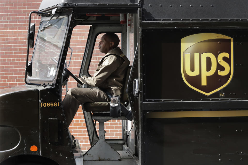 FILE - In this Tuesday, May 9, 2017 file photo, a UPS driver takes his truck on a delivery route in New York. After UPS contract vote, Teamsters drivers feel betrayed. Tens of thousands of Teamsters members earlier this month voted down a five-year contract proposal from United Parcel Service. But less than half of the eligible union members voted, triggering a Teamster rule that allowed the contract to be ratified anyway. Now, many Teamsters members are angry, confused and feel like their union leadership has betrayed them. (AP Photo/Mark Lennihan, File)