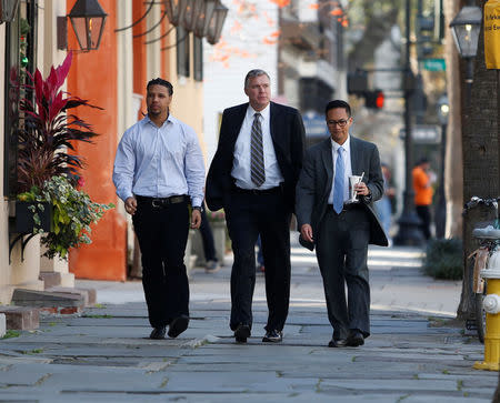 Walter Scott shooting witness Feidin Santana (L), who took the video of the shooting, returns with escorts after a lunch break during the sentencing hearing of former North Charleston police officer Michael Slager in federal court in Charleston, South Carolina, U.S. December 4, 2017. REUTERS/Randall Hill