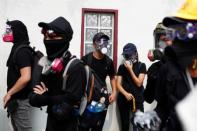 Demonstrators attend a protest in Hong Kong