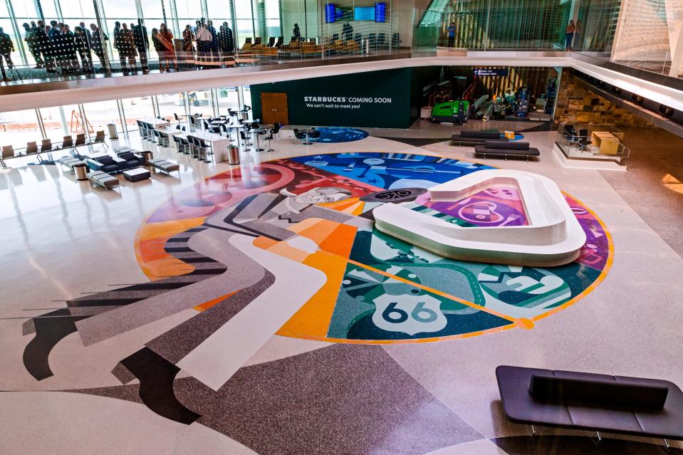 Oklahoma's favorite son, Will Rogers, lassoes the state's history and contributions to science, energy and agriculture in a piece created by Matt Goad to "the city's welcome mat" on the floor of the soon-to-open terminal at OKC Airport.