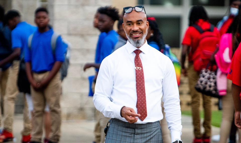 Montgomery Superintendent of Education Melvin Brown welcomes students as they arrive for the first day at Mckee Middle School.