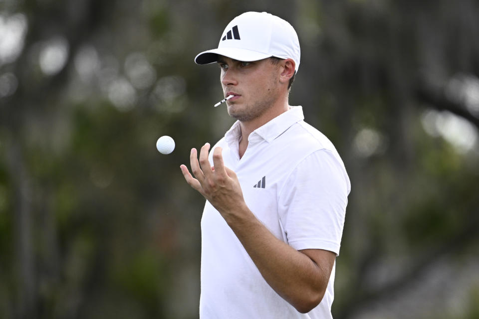 Ludvig Aberg, of Sweden, tosses a ball while waiting to tee off on the 11th hole during the first round of the Arnold Palmer Invitational golf tournament, Thursday, March 7, 2024, in Orlando, Fla. (AP Photo/Phelan M. Ebenhack)