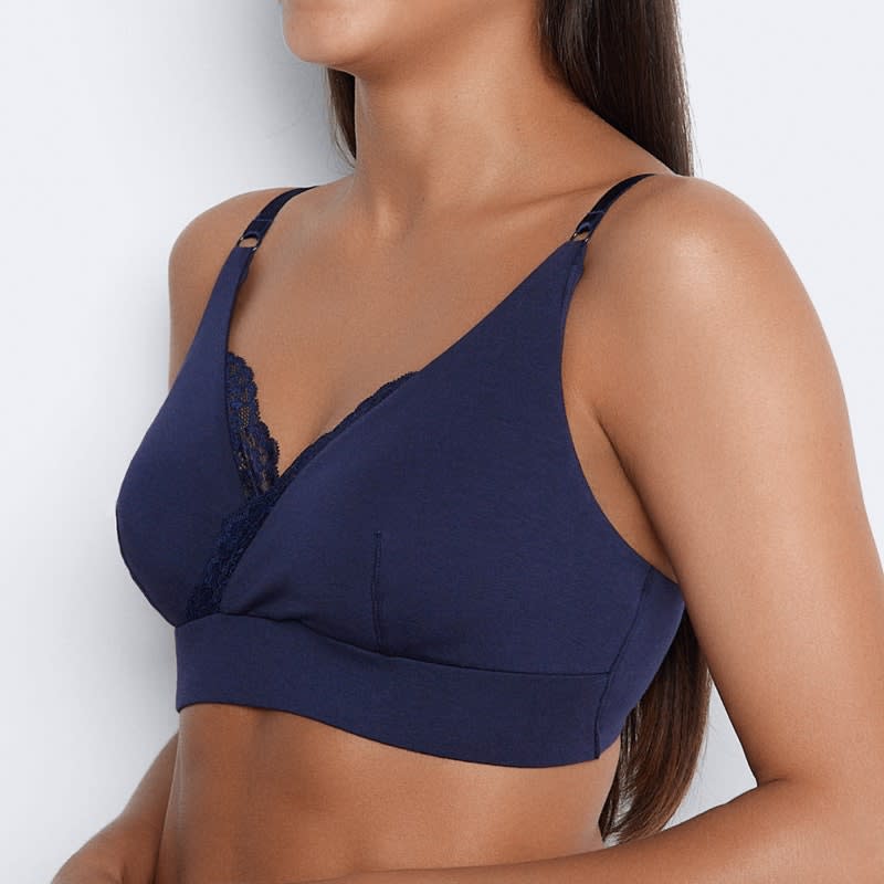 The torso of woman wearing a navy blue Me.byBendon Simply Me Maternity Bra.