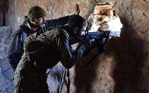 Pro-government fighters in Al-Bab, Aleppo province, in November 2016 - Credit: &nbsp;GEORGE OURFALIAN/&nbsp;AFP