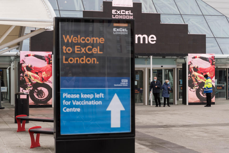 LONDON, UNITED KINGDOM - JANUARY 11, 2021: Visitors leave after receiving the Covid-19 vaccine at NHS Nightingale hospital at the ExCeL exhibition centre, which re-opens today as a mass vaccination centre, on 11 January, 2021 in London, England. Hospitals across the country are dealing with the rapid surge in Covid-19 cases, providing care to more than 30,000 people, which is around 50% more than at the peak of the virus in spring, with fears that hospitals in London may be overwhelmed within two weeks unless the current infection rate falls.- PHOTOGRAPH BY Wiktor Szymanowicz / Barcroft Studios / Future Publishing (Photo credit should read Wiktor Szymanowicz/Barcroft Media via Getty Images)