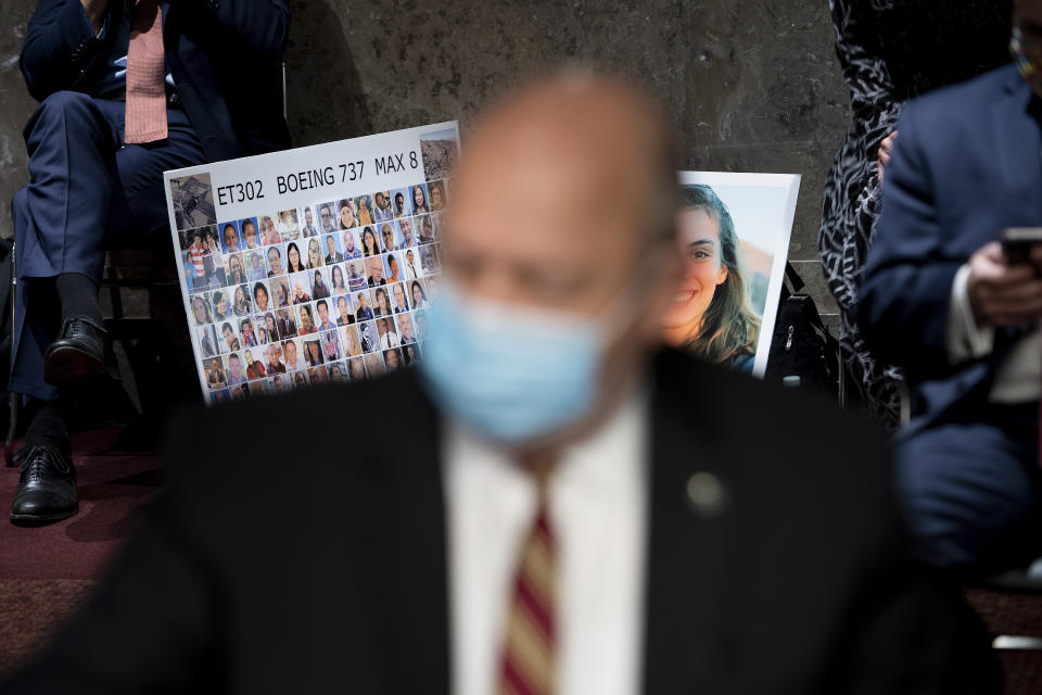 Victims of the Ethiopian Airlines Flight 302 Boeing 737 Max 8 crash including Samya Stumo are seen as Federal Aviation Administration administrator Stephen Dickson waits to speak during a hearing of the Senate Commerce, Science, and Transportation Committee on Capitol Hill Wednesday, June 17, 2020, in Washington. (Brendan Smialowski/Pool via AP)