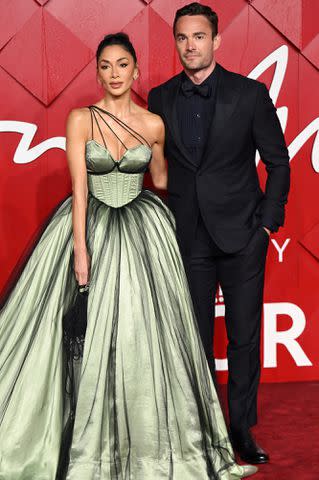 <p>Karwai Tang/WireImage</p> Nicole Scherzinger and Thom Evans attend The Fashion Awards 2023 on December 04, 2023 in London, England.