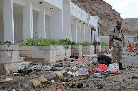 A soldier stands guard at the site of a car bomb attack outside the headquarters of a counter-terrorism unit in Aden, Yemen February 25, 2018. REUTERS/Fawaz Salman