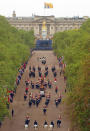 The royal procession heads down the Mall back towards Buckingham Palace.