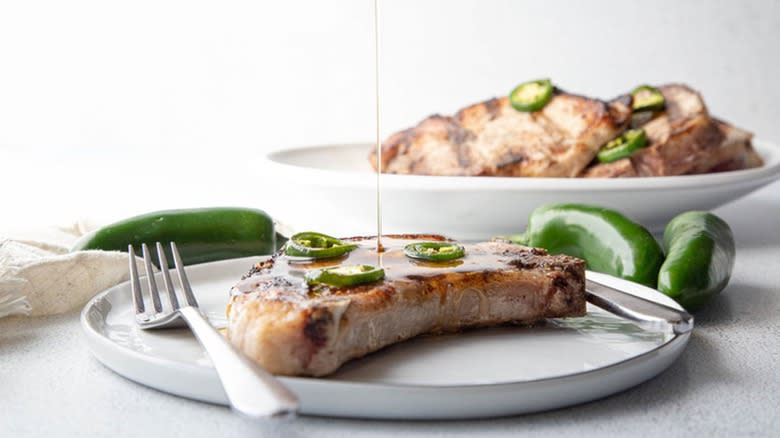 Pork chops with honey drizzle and jalapeños