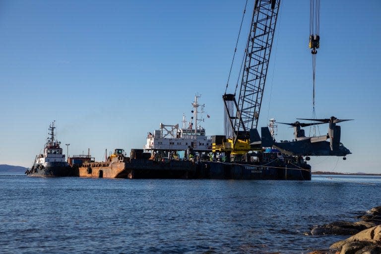 A US Air Force CV-22 Osprey is lifted onto a crane boat in northern Norway on Sept. 27, 2022.