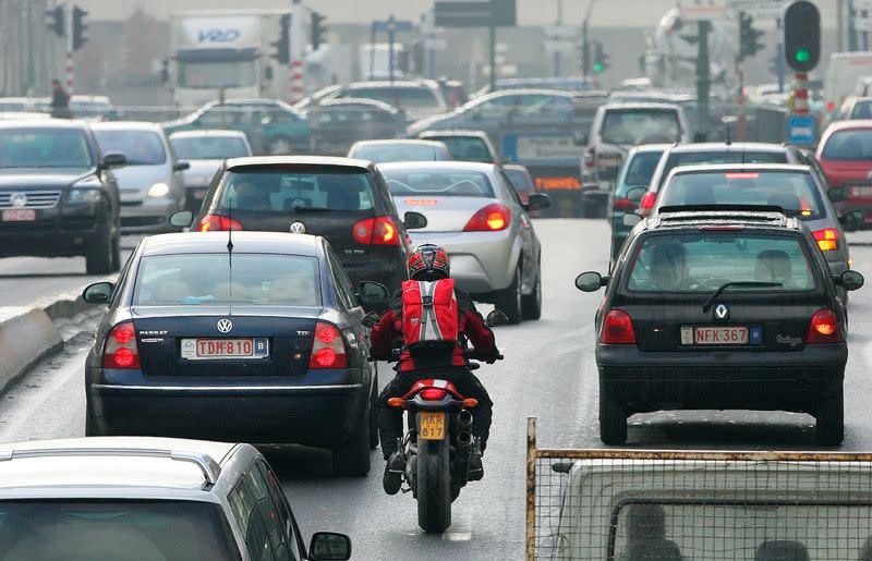 FILE PHOTO: Cars drive along a road in central Brussels