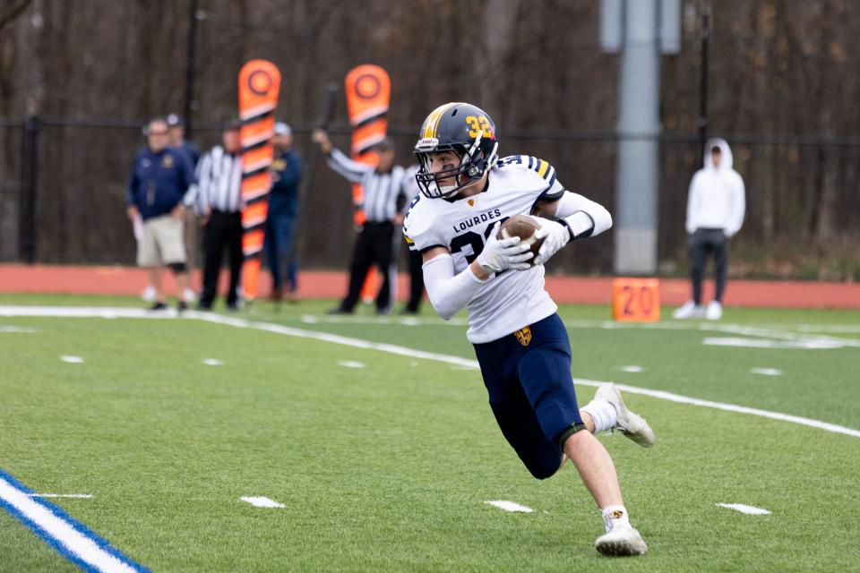 Lourdes' Joseph Tempestelli runs the ball in the Section 9 Class A football championships in Goshen on November 11, 2022.