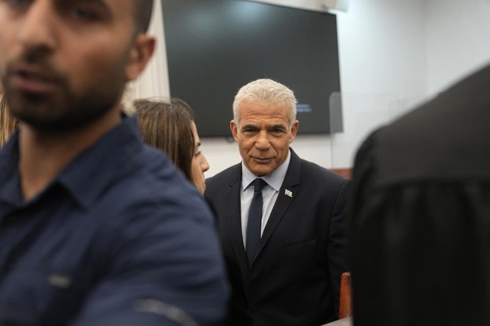 Israeli opposition leader Yair Lapid prepares to testify at the trial of Prime Minister Benjamin Netanyahu on corruption charges at the Jerusalem District Court, in east Jerusalem, Monday, June 12, 2023. (AP Photo/Ohad Zwigenberg)
