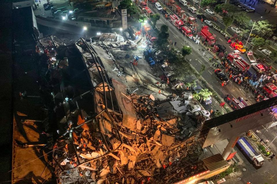 Rescuers search for survivors in the rubble of a collapsed hotel in Quanzhou, in China's eastern Fujian province on March 7, 2020. Source: Getty