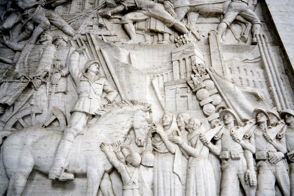 A detail of a giant marble bas-relief titled "The Story of Rome through its Constructions", made in 1940 by sculptor Publio Morbiducci, shows Italian dictator Benito Mussolini on horseback, at the entrance of a building in the EUR neighborhood of Rome, Monday, May 6, 2019. Mussolini transformed Rome’s urban landscape with grand construction projects like EUR, a new city district that was originally designed as celebration of fascism for a world fair in 1942. The fair was canceled due to WWII and construction was halted but resumed after the war. (AP Photo/Andrew Medichini)