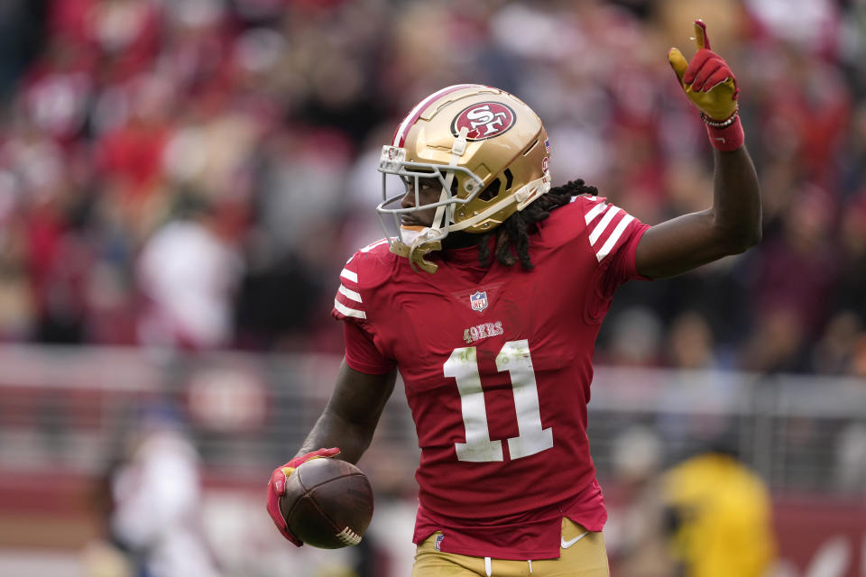 San Francisco 49ers wide receiver Brandon Aiyuk (11) celebrates after scoring a touchdown during the first half of an NFL football game against the Tampa Bay Buccaneers in Santa Clara, Calif., Sunday, Dec. 11, 2022. (AP Photo/Tony Avelar)