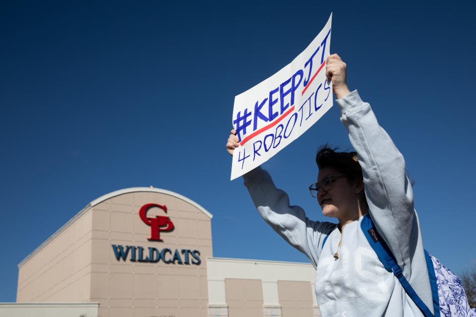 A Gregory-Portland students displays a sign during a walkout on Wednesday, Feb. 21, 2024, in Portland, Texas. The walkout was to show support a STEM and robotics teacher who parted ways with the school after an incident.