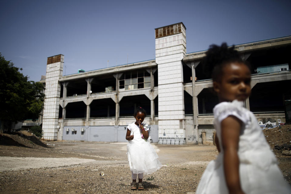 Girls from Eritrea play near the Central Bus Station on May 25. (Photo: Corinna Kern/Reuters)