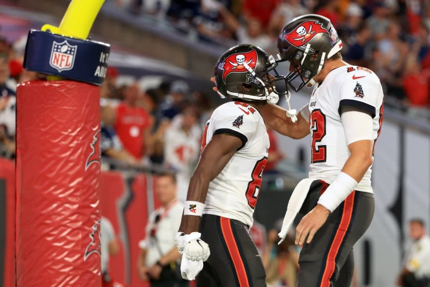 TAMPA, FLORIDA - SEPTEMBER 09: Antonio Brown #81 and Tom Brady #12 of the Tampa Bay Buccaneers celebrate their touchdown during the second quarter against the Dallas Cowboys at Raymond James Stadium on September 09, 2021 in Tampa, Florida. (Photo by Mike Ehrmann/Getty Images)