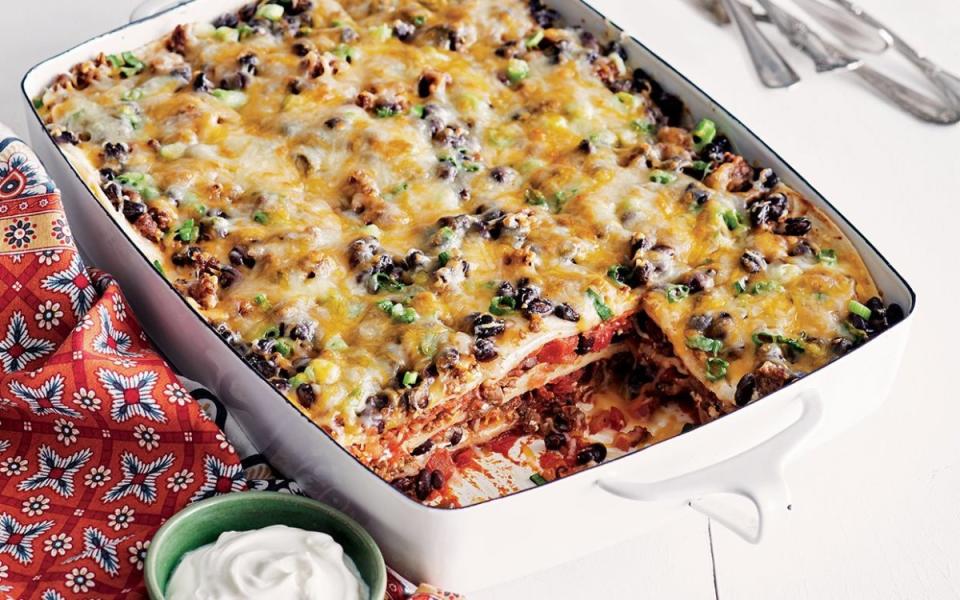 <p>Danielle Atkins</p><p>When your crew can’t agree on enchiladas or <a href="/1264676/parade/best-lasagna/" data-ylk="slk:lasagna;elm:context_link;itc:0;sec:content-canvas" class="link ">lasagna</a>, make everyone happy with this quick and easy weeknight <a href="/986637/parade/casserole-recipes/" data-ylk="slk:casserole;elm:context_link;itc:0;sec:content-canvas" class="link ">casserole</a>! Get the recipe <a href="/940604/parade/mexican-lasagna-is-the-budget-friendly-meal-youll-appreciate-during-the-holidays/" data-ylk="slk:HERE;elm:context_link;itc:0;sec:content-canvas" class="link ">HERE</a>.</p>