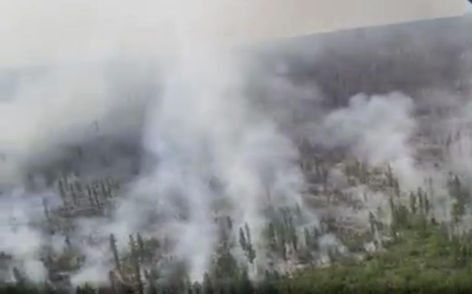 This image taken from video provided by Russian Emergency Ministry, shows a view of a forest fire in the Ust-Udinsky district of Krasnoyarsk region, Russia Far East, on Saturday, July 4, 2020. More than 2,000 hectares of forest were alight over a large area of the Russia's region, according to the ministry of emergency situations. (Russian Emergency Ministry via AP)