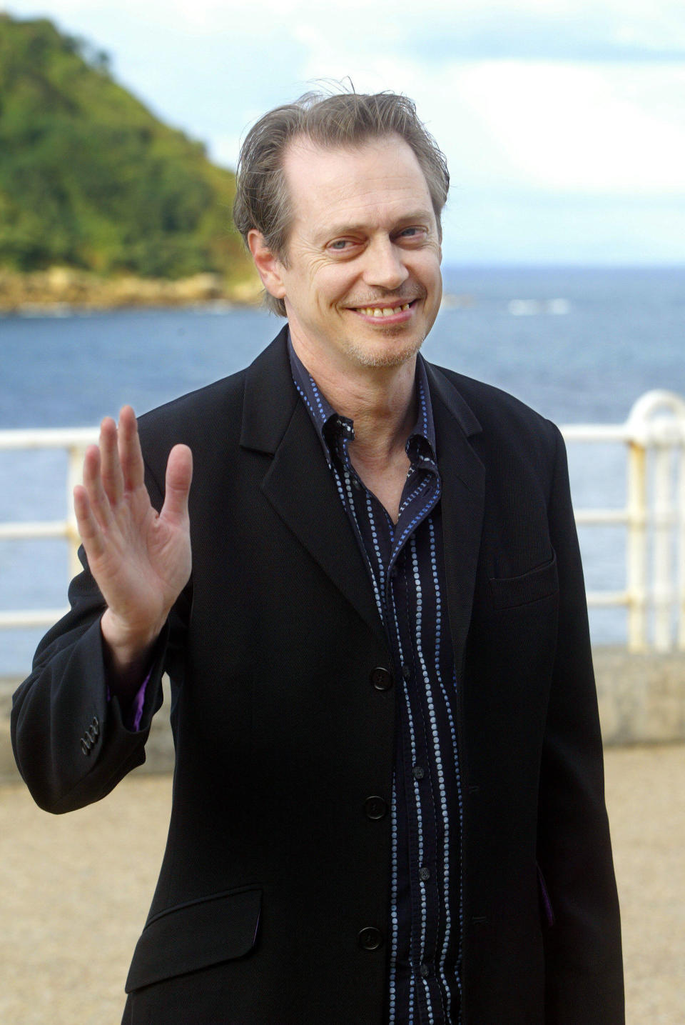 Steve Buscemi waving hello.