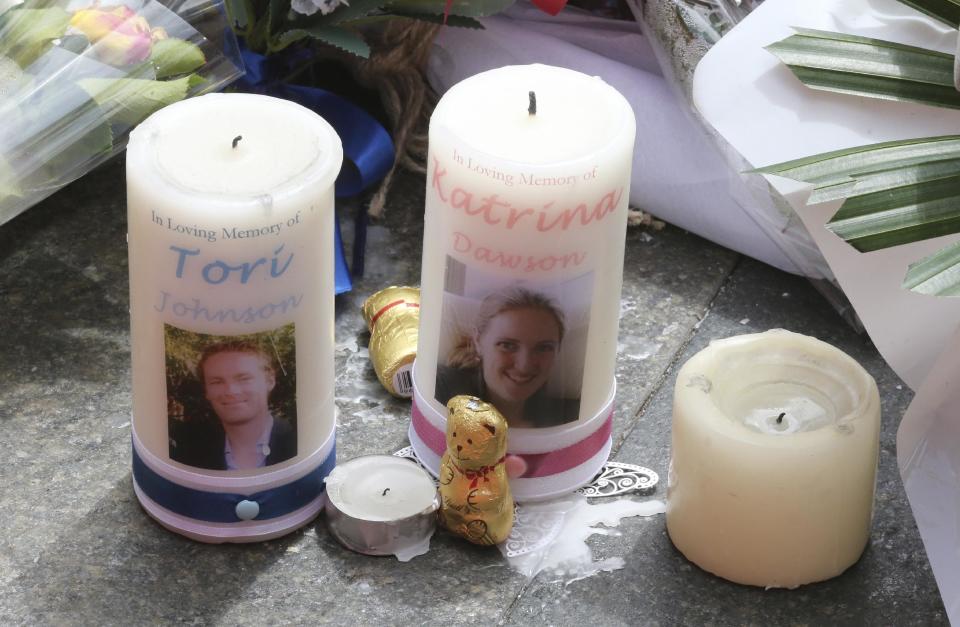 Two candle tributes with photos of siege victims Tori Johnson left, and Katrina Dawson are seen at a temporary memorial site close to the Lindt cafe in the central business district of Sydney, Australia, where people continue to stream past to leave floral tributes on Thursday, Dec. 18, 2014. Australia&#39;s Prime Minister Tony Abbott said Thursday that a deadly siege in the Sydney cafe may have been preventable, as the chorus of critics demanding to know why the gunman was out on bail despite facing a string of violent charges grew louder. (AP Photo/Rob Griffith)