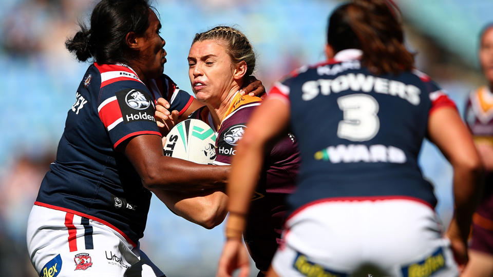 Julia Robinson runs into the Sydney Roosters defence during an NRLW match.