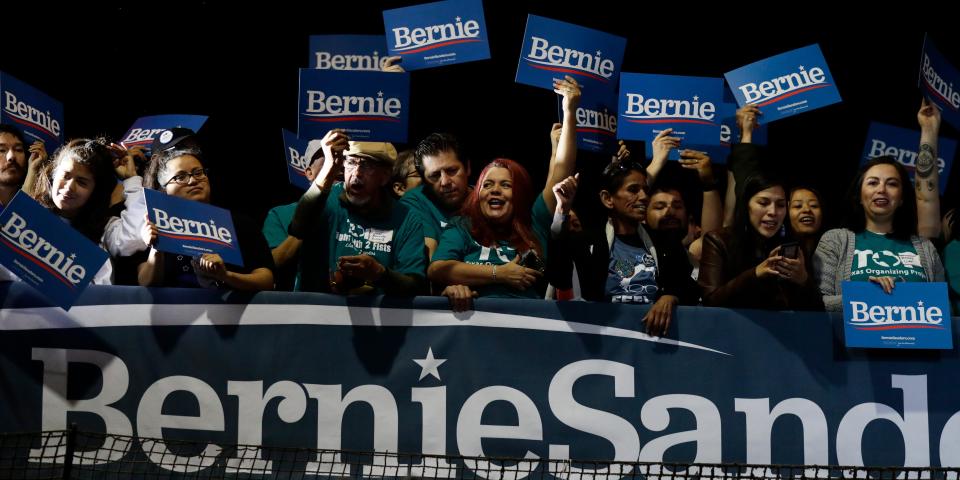 Supporters of Democratic presidential candidate Sen. Bernie Sanders, I-Vt., cheer as they watch results of the Nevada Cacus during a campaign event in San Antonio, Saturday, Feb. 22, 2020. (AP Photo/Eric Gay)