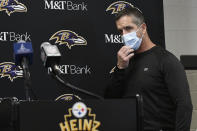 Baltimore Ravens head coach John Harbaugh arrives to take questions during a new conference after an NFL football game against the Pittsburgh Steelers, Sunday, Dec. 5, 2021, in Pittsburgh. (AP Photo/Don Wright)