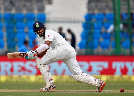Cricket - India v New Zealand - First Test cricket match - Green Park Stadium, Kanpur, India - 22/09/2016. India's Cheteshwar Pujara plays a shot. REUTERS/Danish Siddiqui