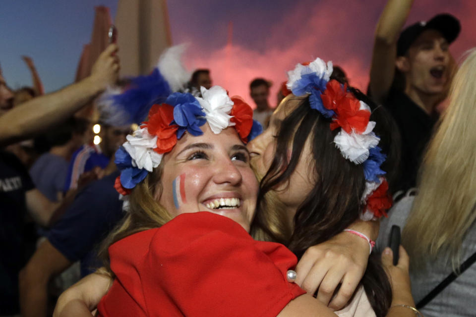 <p>French soccer fans hug each other on the final whistle as they watch a live broadcast of the semifinal match between France and Belgium at the 2018 soccer World Cup, in Marseille, southern France, Tuesday July 10, 2018. France has advanced to the World Cup final for the first time since 2006 with a 1-0 win over Belgium. (AP Photo/Claude Paris) </p>