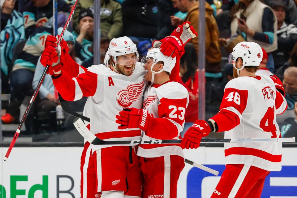 Red Wings defenseman Ben Chiarot, left, celebrates with left wing Lucas Raymond after scoring a goal during overtime of the Wings' 4-3 win on Monday, Feb. 19, 2024, in Seattle.