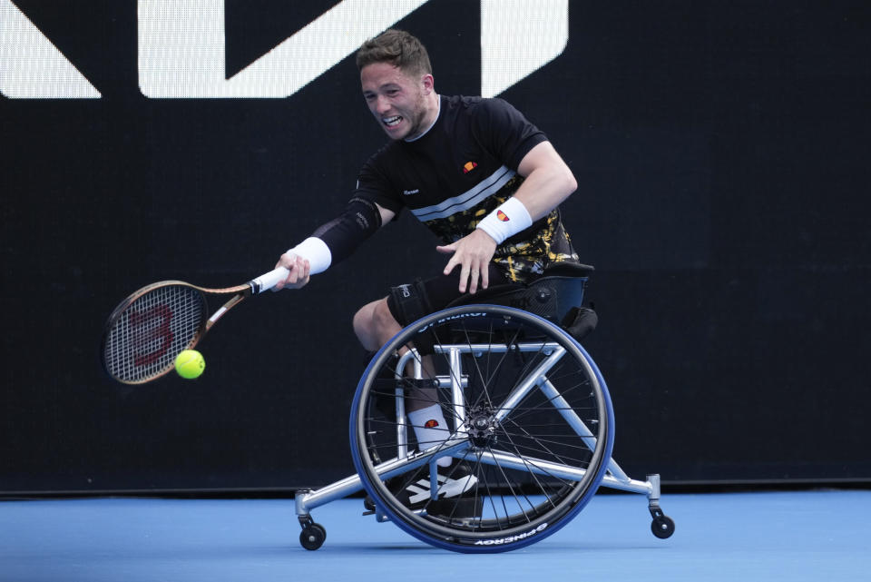 Alfie Hewett of Britain plays a forehand return to Tokito Oda of Japan during the men's wheelchair final at the Australian Open tennis championships at Melbourne Park, Melbourne, Australia, Saturday, Jan. 27, 2024. (AP Photo/Alessandra Tarantino)