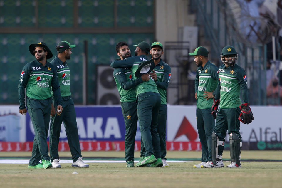 Pakistan's Shahdab Khan, center, celebrates with teammates after taking the catch of West Indies Shamarh Brooks during the first one day international cricket match between Pakistan and West Indies at the Multan Cricket Stadium, in Multan, Pakistan, Wednesday, June 8, 2022. (AP Photo/Anjum Naveed)