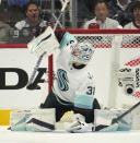 Seattle Kraken goaltender Philipp Grubauer deflects a shot in the second period of Game 7 of an NHL first-round playoff series against the Colorado Avalanche, Sunday, April 30, 2023, in Denver. (AP Photo/David Zalubowski)