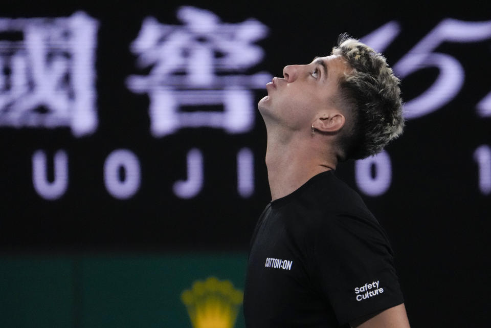 Thanasi Kokkinakis of Australia reacts after losing a point to Andy Murray of Britain during their second round match at the Australian Open tennis championship in Melbourne, Australia, Friday, Jan. 20, 2023. (AP Photo/Ng Han Guan)